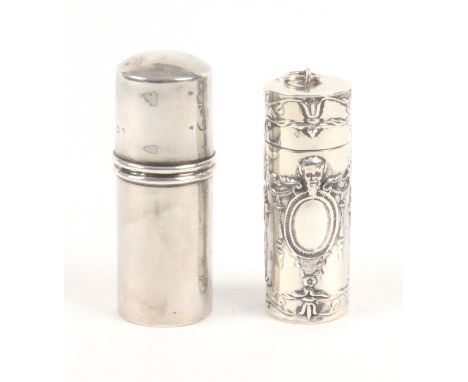 Two silver cylinder form sewing compendiums, the first decorated with masks, oval cartouches, and flower garlands and contain