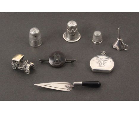 Eight small silver and other white metal pieces, comprising a model of a vintage motor car stamped 'Italy 925', 2.5cms, an un