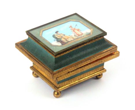 A fine French bonbonniere, circa 1830, of sarcophagol form in grained green paper and gilt foil raised on four ball feet, the