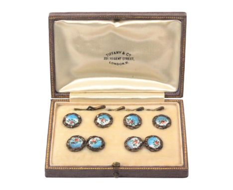 Buttons - Tiffany and Co., a cased set of four buttons and two pairs of chain linked buttons, pierced gilt metal frames set w