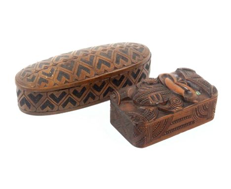 Two wooden boxes, comprising a rectangular Maori carved box, circa 1920, geometric carved sides, the sliding lid carved with 