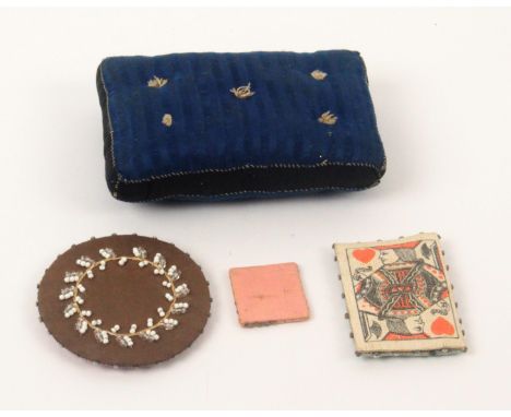 Four pin cushions and retainers, comprising a rectangular pin card in the form of the jack of hearts playing card, pin stuck 