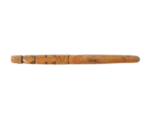 A fruitwood knitting stick, the five stage geometric carved shaft below a belt slot to a turned tapering terminal, crudely ca