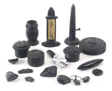 A collection of Irish bog oak and Whitby jet, comprising four bog oak circular boxes, two titled 'Muckross', largest 6.8cms, 