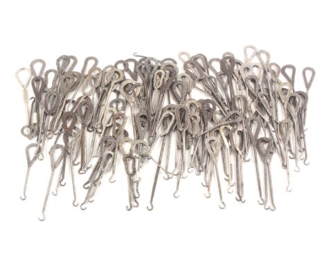 A collection of circa 120 steel button hooks, with loop handles mostly featuring adverts, circa 1900, largest 19cms. (120) Fr