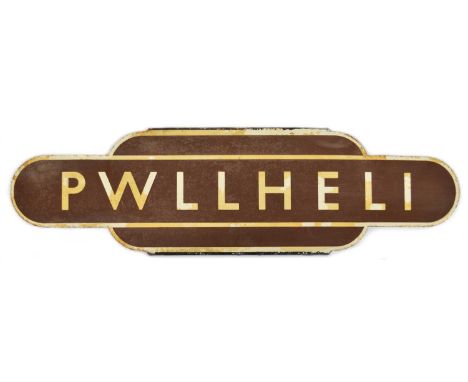 BR(W) Brown enamel totem for 'PWLLHELI'. Pwllheli railway station is a railway station serving the small coastal town of Pwll