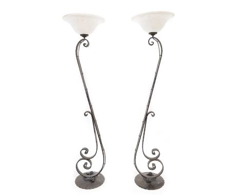 Pair of wrought metal Italian, Art Nouveau design torchiere, floor uplight lamps with scroll form. The edges have a carved pa