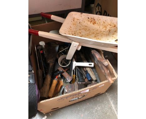 A box of tools including toy wheelbarrow 