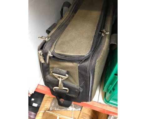 An electrician's bag containing mixed tools 