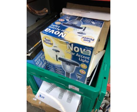 A box of boxed items, solar light, telephone, a baking set, TV aerial, etc 