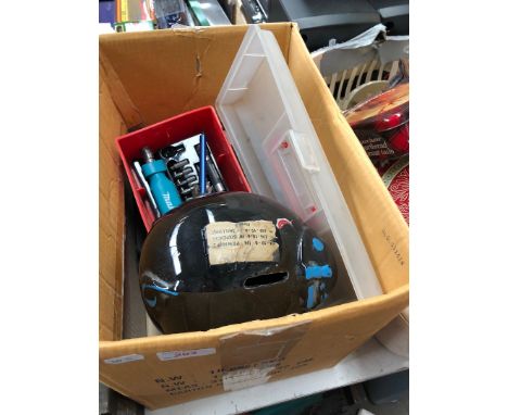 Box containig piggy bank, universal avometer, vintage car badges and makita screwdriver set 