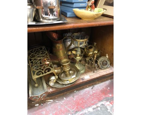 Shelf of various brassware 