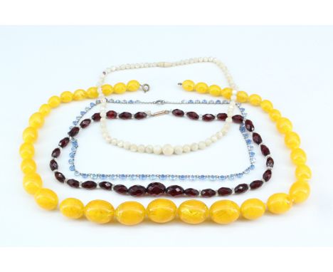 Two vintage faceted glass bead necklaces, a mother-of-pearl necklace and another of amber coloured beads