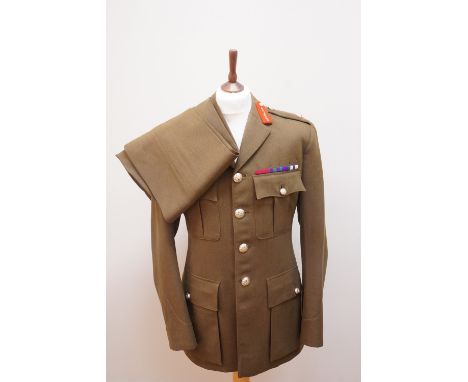 An early 1970s British army major general's service tunic, together with a pair of trousers, the former labelled, dated 1970 