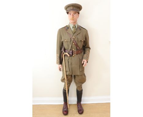 A mannequin display representing a Great War Border Regiment captain, including a period cuff rank tunic, Sam Browne accoutre