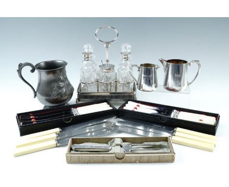 A group of period electroplate including a cut glass cruet set and stand, a Victorian EPBM baluster tankard, a boxed Elkingto