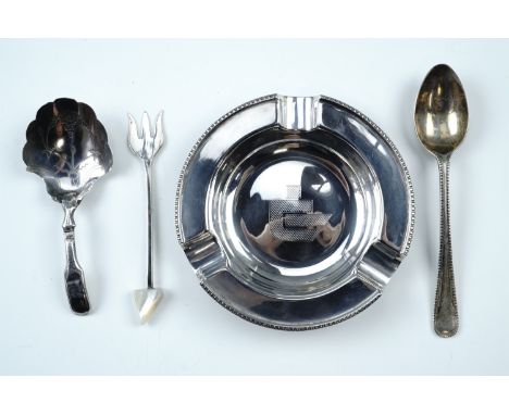 A Georgian silver caddy spoon together with a silver ashtray, a silver pickle fork and tea spoon