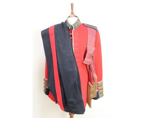 A post 1952 Grenadier Guards officer's dress tunic, trousers and waist sash, the tunic bearing the name 2 Lt Forbes