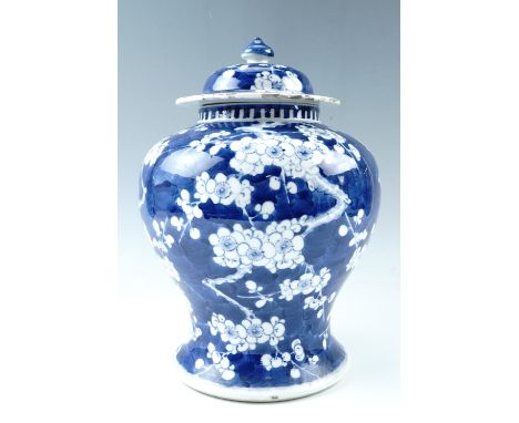 A Quing Chinese prunus pattern covered jar, four character Kangxi marks to base, (a/f), 28 cm