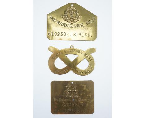 Three various British army other ranks' brass duty plates including a Staffordshire Regiment knot-shaped example