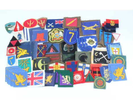 A large quantity of British army period and reproduction cloth insignia