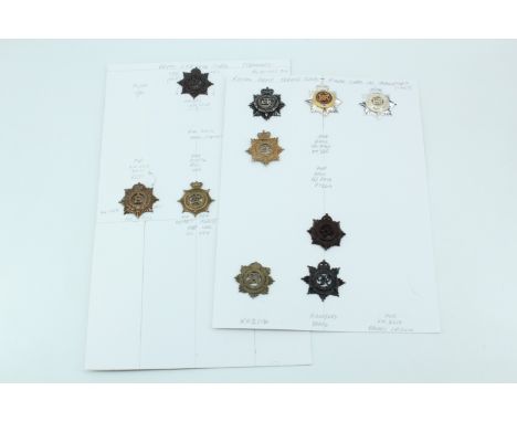 A group of Army Service Corps cap badges