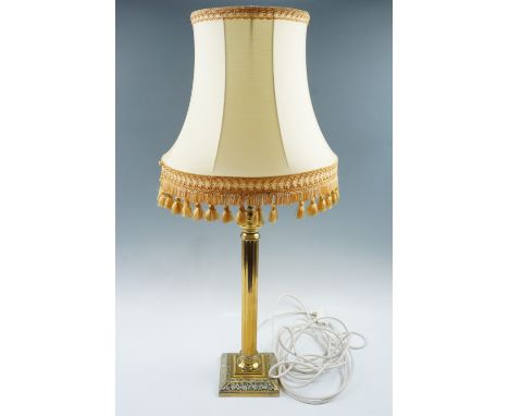 A brass classical columnar table lamp, 57 cm to top of socket, 82 cm overall