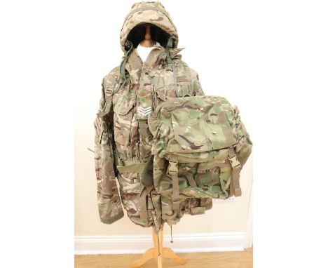 A group of current British army combat camouflaged and other clothing, a helmet and cover, together with a set of load carryi