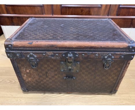 A late 19th / early 20th Century French travel trunk by Bigot of Paris, constructed from wood with a characteristic checkered
