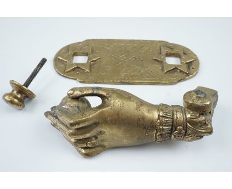 A late 20th Century cast brass door knocker in the form of a hand, backplate 9 x 7.5 cm