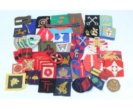 A quantity of largely period British army cloth insignia