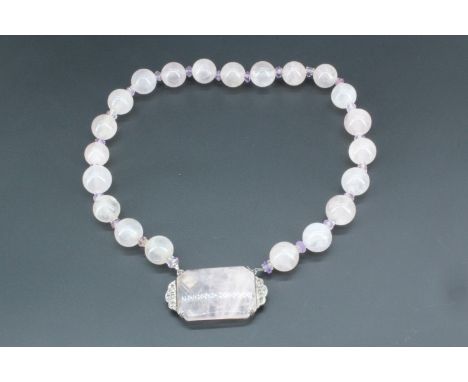 A vintage Art Deco rose quartz and amethyst necklace, of rose quartz spherical beads divided by smaller faceted amethyst and 