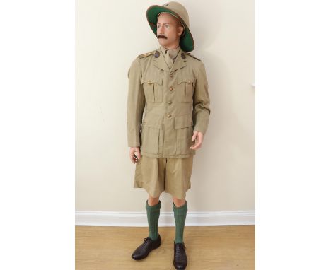 A mannequin display representing an inter-War Border Regiment officer, the Wolseley pattern helmet, khaki drill tunic and sho