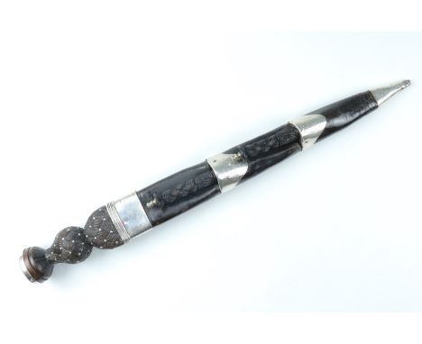 A late Georgian Scottish Highland dirk mounted in white metal (tested as silver), of traditional form, the scabbard mounts de