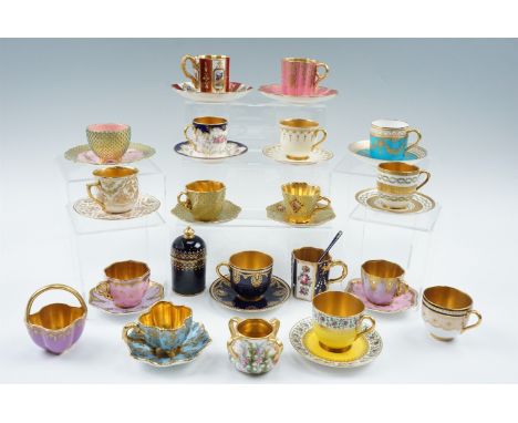 A collection of Coalport, Royal Worcester and other cabinet cups and saucers etc, together with an enamelled silver coffee sp