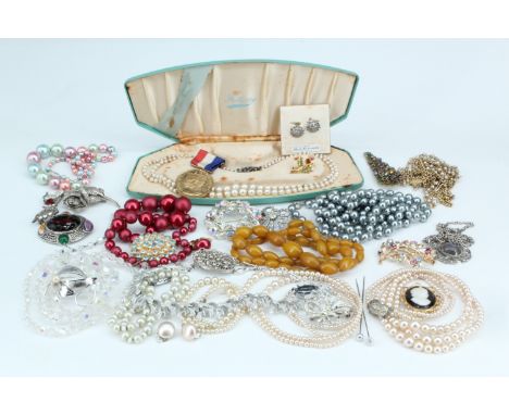 A large quantity of vintage costume jewellery and a Gothic chip carved wooden casket