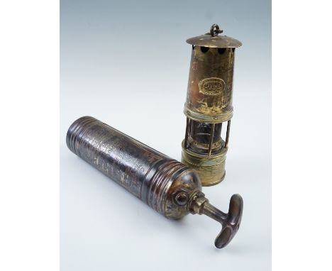 A Prima miner's safety lamp together with a Pyrene fire extinguisher