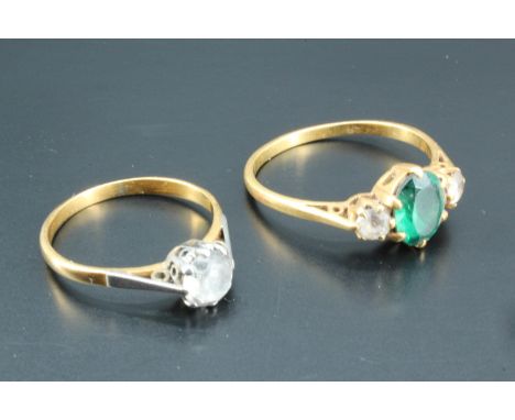 A green and white stone ring, the stones set on high carat yellow metal, together with a solitaire white stone ring similarly