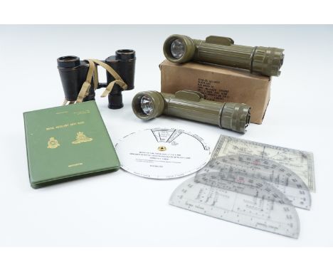 A group of late 20th Century British army navigational and artillery computational instruments, together with two army torche