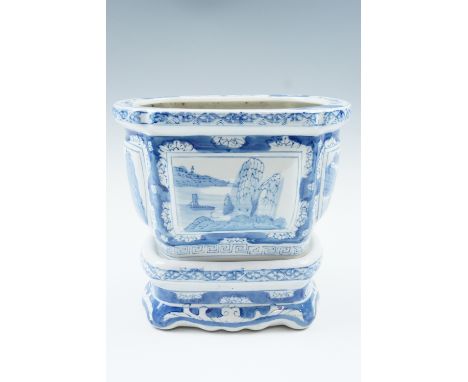 A contemporary blue and white planter and stand 23 cm high