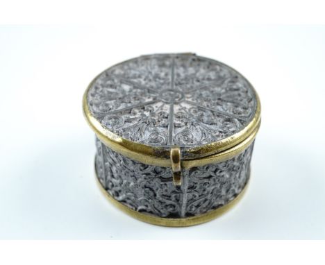A late 19th Century brass-mounted embossed tinplate drum-form pill or trinket box, 4.5 cm x 2.5 cm