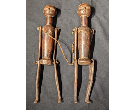 A pair of Indonesian ancestral puppet articulated figures, 20th century, Indonesia or Borneo, H.50cm