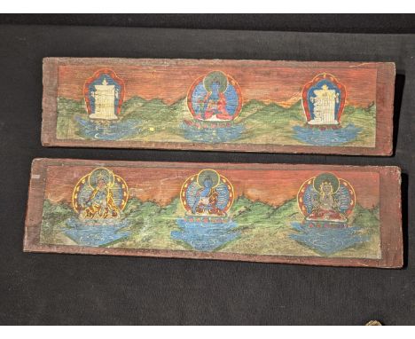 A pair of Tibetan or North Indian Buddhist manuscript covers, mounted with turquoise and coral, the other sides depicting pai