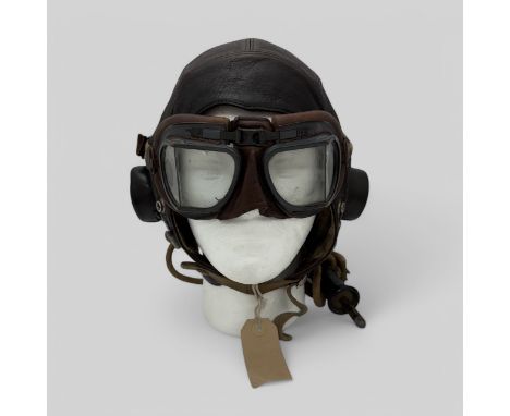 WW2 RAF C Type Flying Helmet with coms wiring, fitted with goggle straps and elastic chinstrap. Black rubber earcups containi