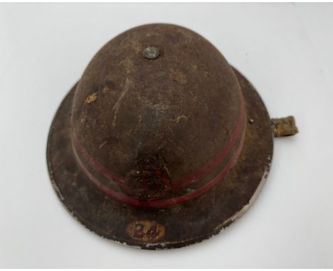 Second World War National Fire Service (NFS) tin fire helmet, a dark green helmet having NFS transfer to front one red line, 