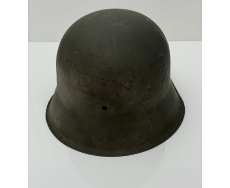 A WWII Third Reich M42 steel helmet, marked CKL 64 (C and K very indistinct). Repainted