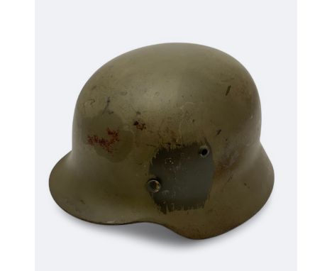 A German M35 ET-64 Norwegian used helmet with original German liner band.