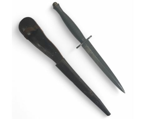 Second World War Fairburn Sykes third pattern commando fighting knife with leather scabbard. Double edged blade. Marked 3 to 