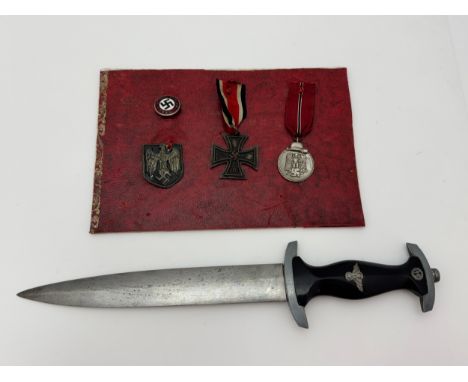 Germany, Third Reich range to include; 1939 Iron Cross Second Class with ribbon, 1933 Adolf Hitler NSDAP enamel badge, Tropic