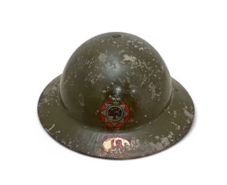 Second World War National Fire Service (NFS) tin fire helmet, a dark green helmet having NFS transfer to front, unit number 1